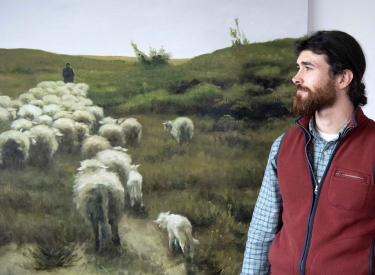 Franco A. im Büro seines Verteidigers im Hintergrund Bild einer Schafherde